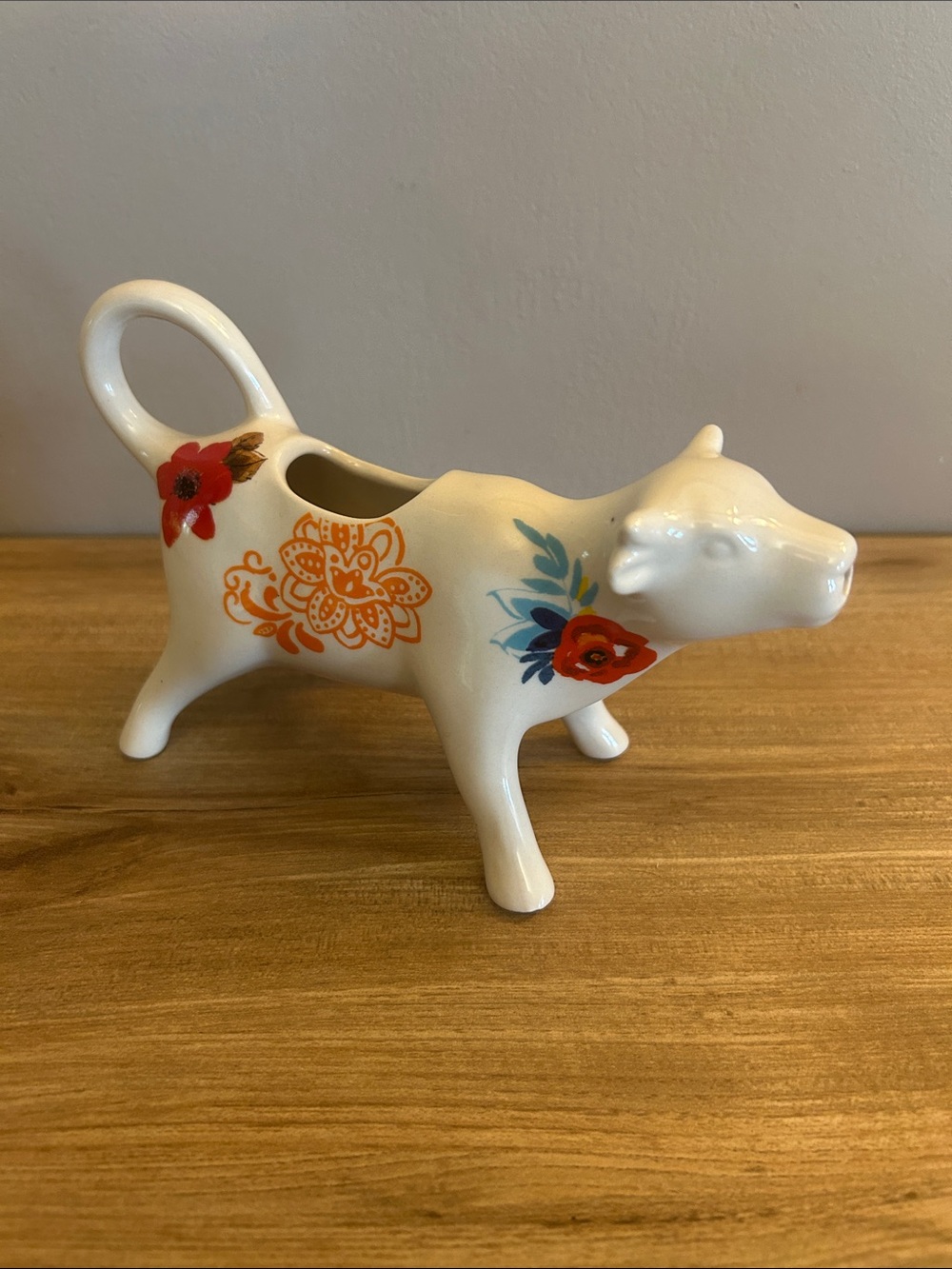 The Pioneer Woman White Ceramic Cow Creamer with Red and Orange Floral Accent